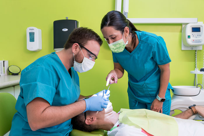 Doctors are performing a dental crown procedure in Cancun.