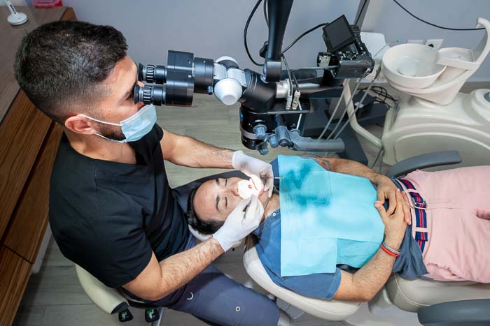 The patient is undergoing root canal treatment in Cancun